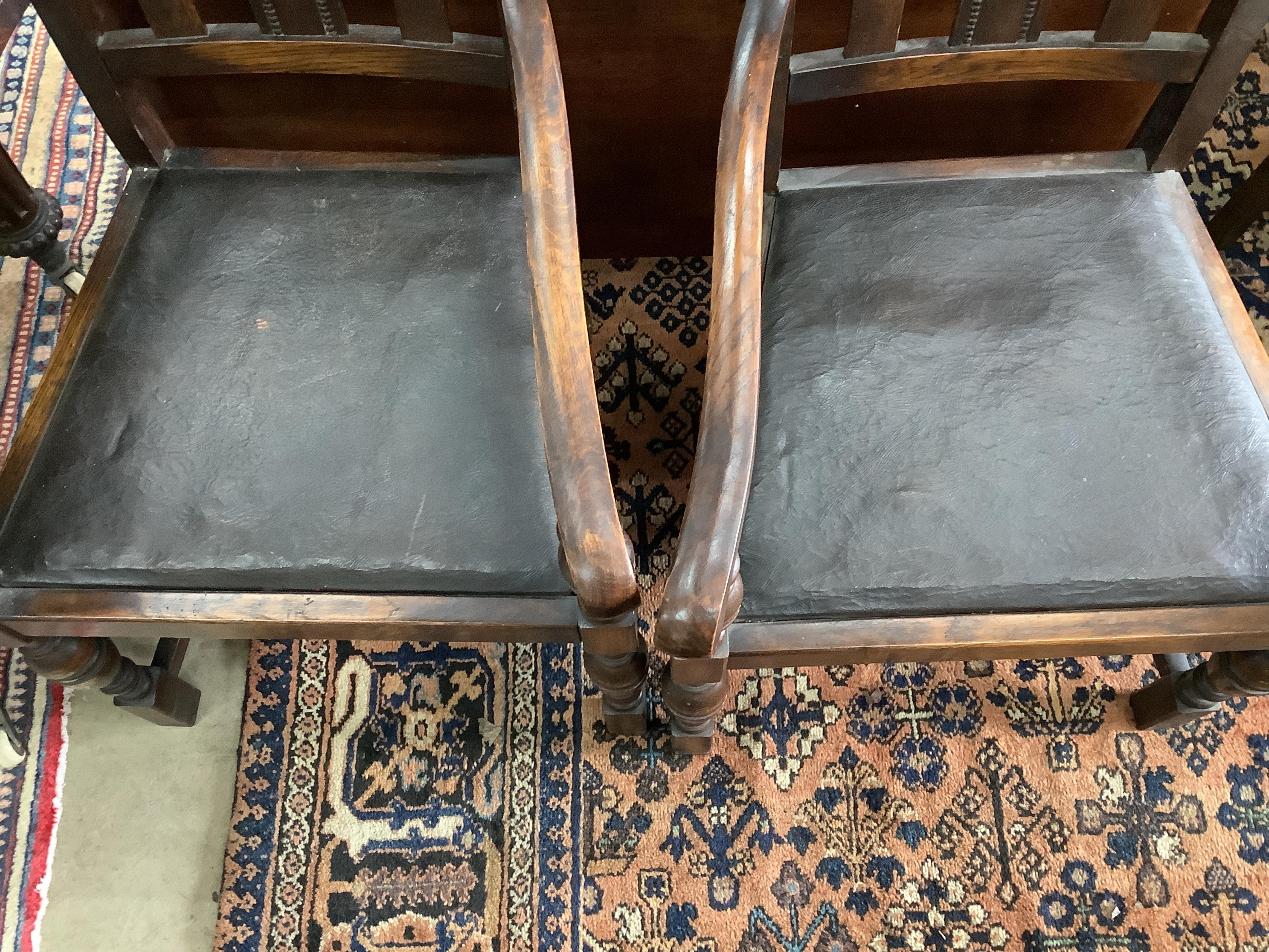 Eight 1920's oak dining chairs, two with arms
